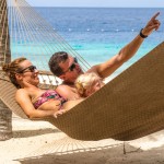 Caribbean honeymoon destinations - couple on beach at Harbour Village Bonaire