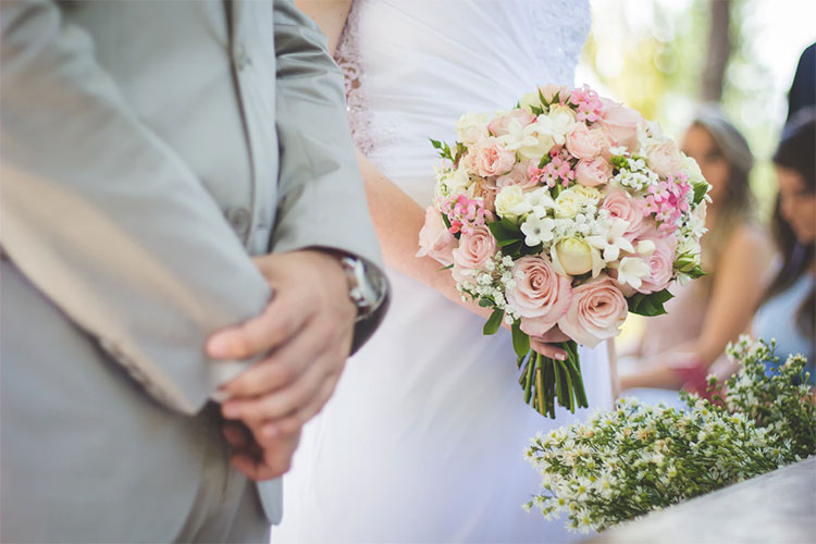 Wedding flowers and bride and groom