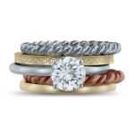 Stackable rings around engagement ring